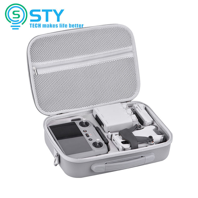 Gray hard-shell waterproof drone storage case with molded interior and zipper, carrying tools