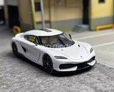 1:64 white sports car diecast model with black wheels and front grille detail