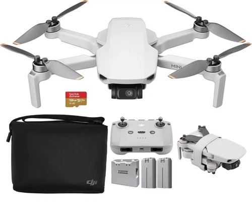 White DJI Mini 2 drone with controller, batteries, charging hub, and black carry case