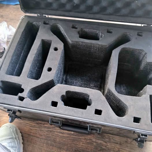 DJI Phantom 3 hard case with molded foam insert holding drone components