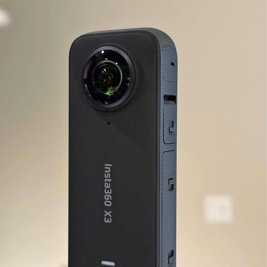 Insta360 X3 waterproof 360 action camera, front lens view, black and gray
