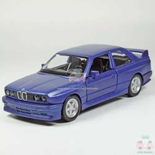 1/36 BMW M3 1987 diecast model car, matte blue, front three-quarter view