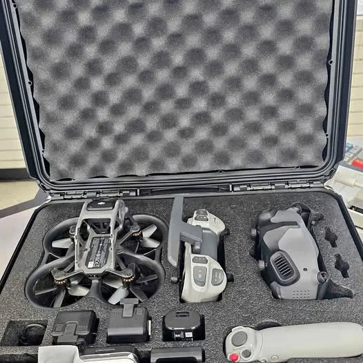 Foldable drone, remote controller, and accessories in open hard case
