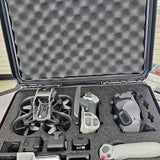 Foldable drone, remote controller, and accessories in open hard case