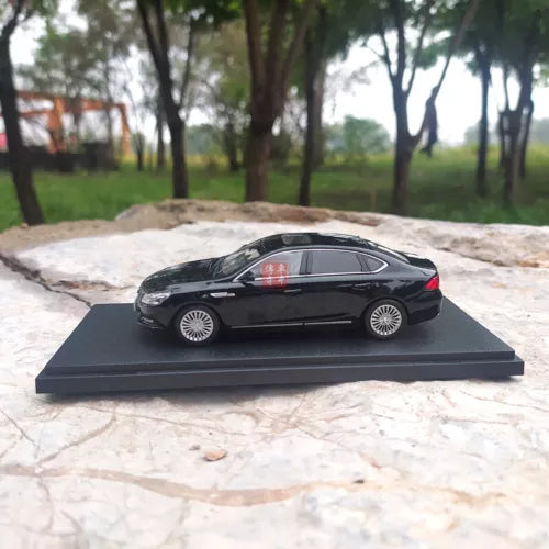 1:43 GAC Trumpchi GA8 black diecast model car, side view on display base