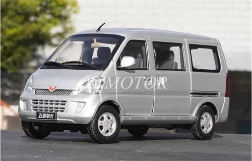 Silver diecast MPV van model car, front-left view with detailed grille and wheels