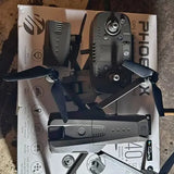 Compact quadcopter drone with foldable prop arms and controller, dark gray.