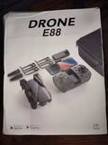 Drone E88 box packaging with pictured quadcopter and controller, 14+ ages label