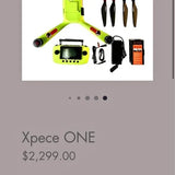Green quadcopter drone with front camera and attached display screen