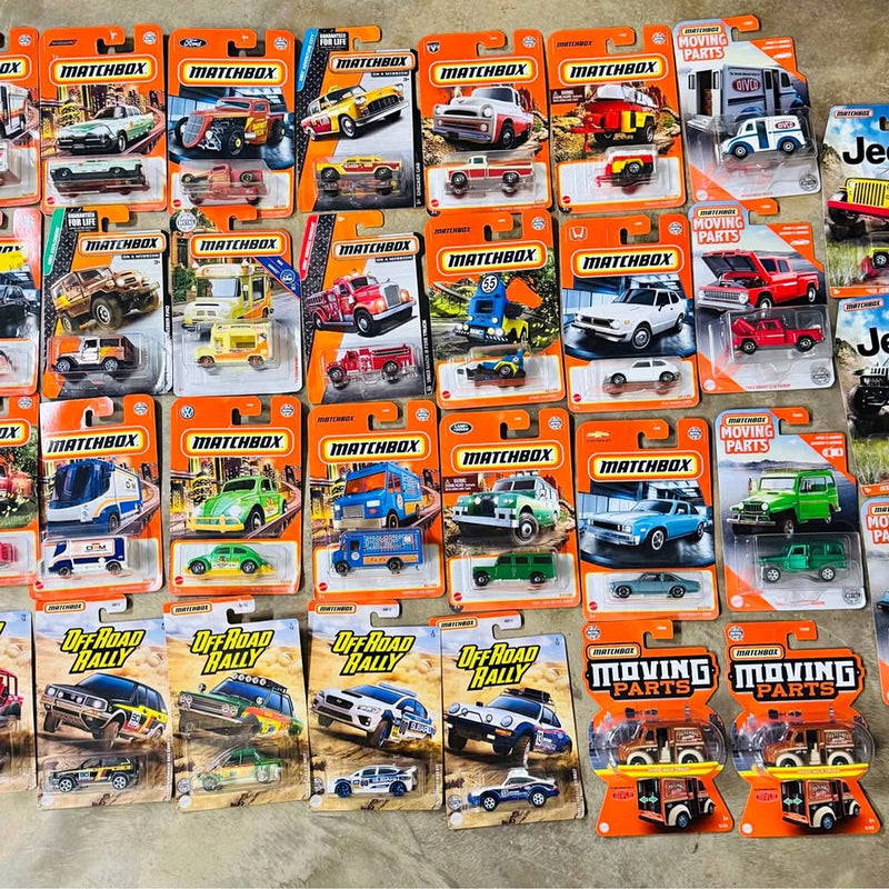 Mixed Matchbox diecast cars lot, boxed vehicles with off-road and moving parts