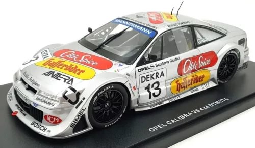 White Opel Calibra diecast race car model with number 13, front three-quarter view
