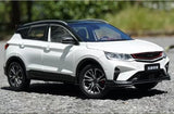 White 1:18 scale diecast SUV model car with black alloy wheels, front 3/4 view.