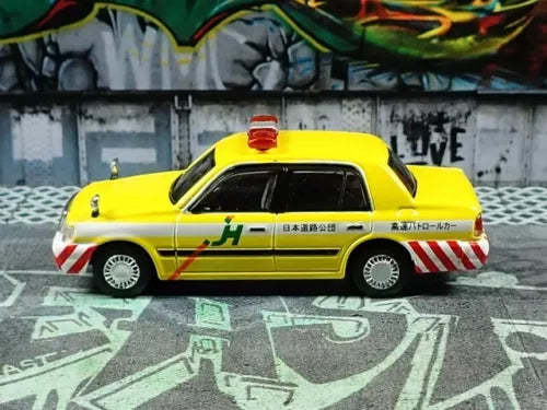 Yellow Toyota SUV diecast model car with roof detail and side graphics