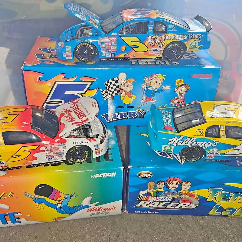 1:24 diecast stock car collection with three race cars in packaging, blue and yellow