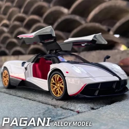 Diecast racing model car, white with black accents, red interior, gold wheels
