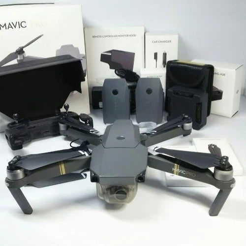 Folding quadcopter drone with front camera and arms, plus charging and controller accessories