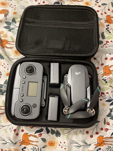 Compact drone kit in zippered hard case, with camera drone and phone holder