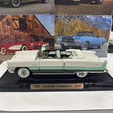 1955 Packard Caribbean diecast car model, two-tone white and green, open-top.