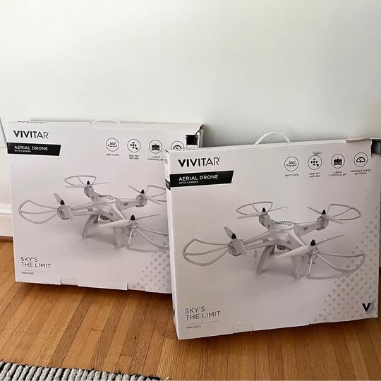 Aerial drone product boxes with drone illustrations and VIVITAR branding