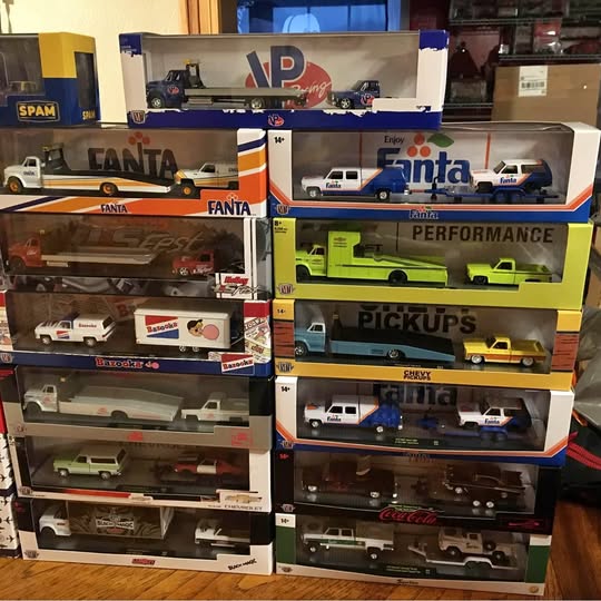 Assorted boxed 1:64 diecast cars on store display shelf