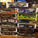 Assorted boxed 1:64 diecast cars on store display shelf