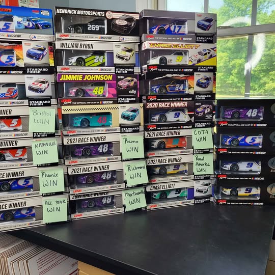 1/24 scale NASCAR diecast cars set in retail display boxes, assorted race cars