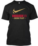 Black crewneck T-shirt with gold swoosh and text: FAA CERTIFIED PART 107 DRONE PILOT
