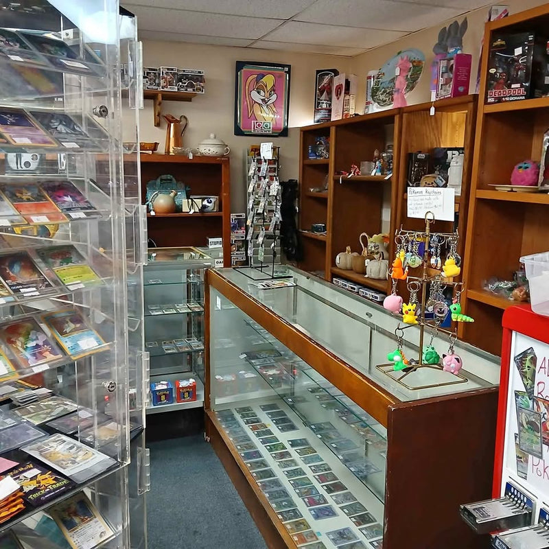Glass display case with colorful collectible figurines on shelves