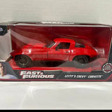 Red diecast sports car model in collector display box