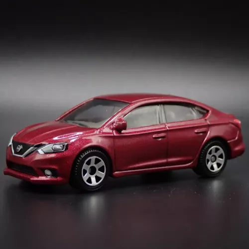 Maroon diecast sedan model car, 4-door, front three-quarter view
