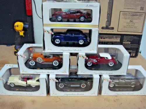 Diecast car set with six cars in original display boxes, with clear windows