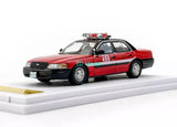 Red 1:64 diecast Crown Victoria model car toy, front three-quarter view