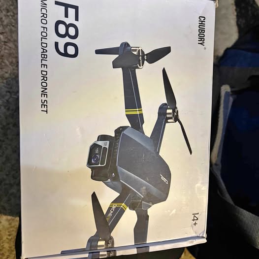 Long-range HD camera drone box, gray quadcopter illustration with camera