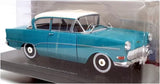 Blue and white 1957 Opel Olympia Rekord diecast car model with wheels and chrome grille