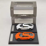 Diecast hybrid supercar model set, orange and white Koenigsegg Gemera in display box