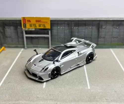 1:64 silver sports model diecast metal car, front 3/4 view with black wheels