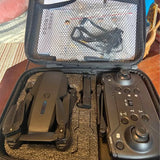 Small drone and remote controller in a hard-shell carrying case