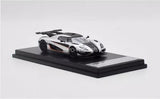 1/64 scale Koenigsegg One:1 silver diecast car toy on display base, black accents