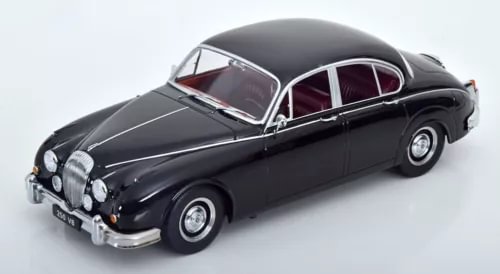 Black 1962 diecast passenger car with chrome grille and whitewall tires, left-front view
