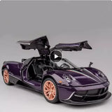 Purple and black alloy racing car model with orange wheels