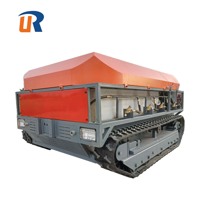 Tracked agricultural drone sprayer with orange tank housing and grey frame, front light panel