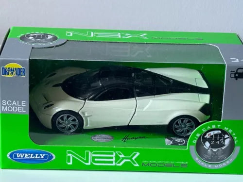 Diecast sports car model with white body and black roof, shown in retail box