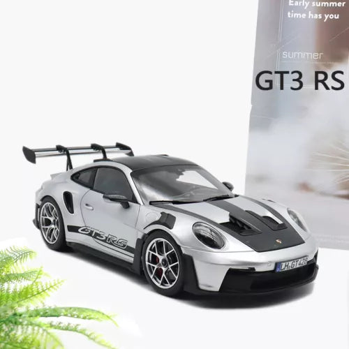 1:36 diecast race car model with white body, black hood stripes, rear wing