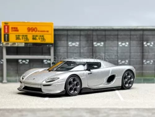 Silver 1:64 scale racing sports car diecast model with black wheels and side vents