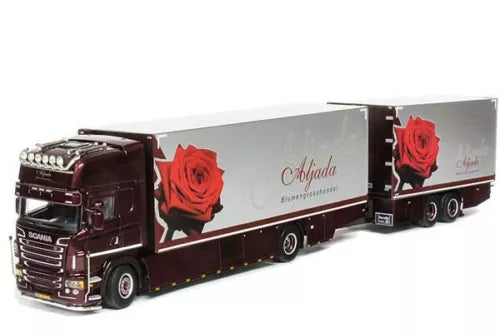 Diecast model truck with maroon cab and gray trailer, red rose graphics, multiple axles