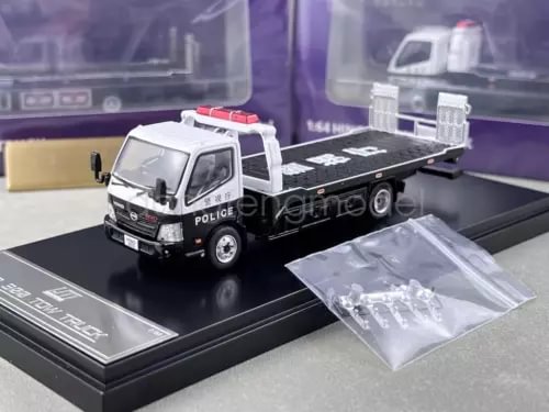 1:64 police flatbed tow truck diecast model, white and black, with parts bag