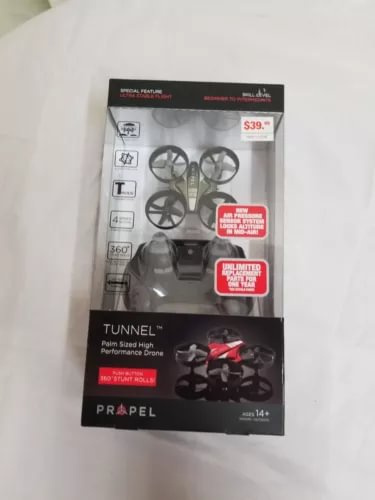 Palm-sized tunnel drone in retail packaging, black with propellers