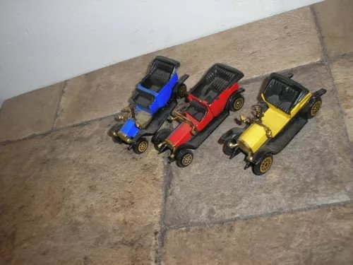Set of three diecast classic cars: blue, red, and yellow with black wheels