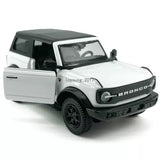 White diecast Ford Bronco model car with open driver door and black grille