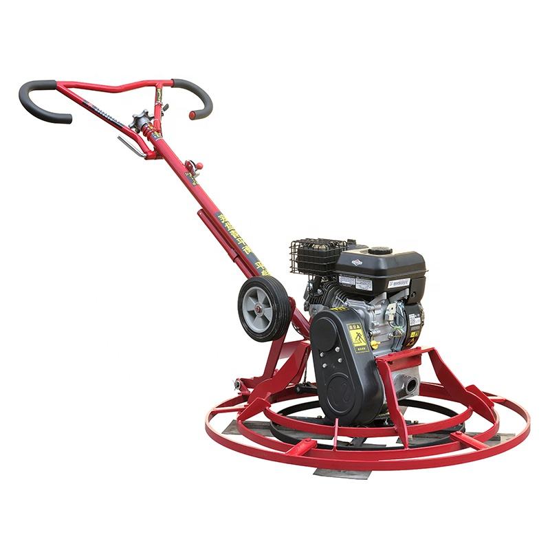 Red concrete floor power trowel with engine and round trowel blades